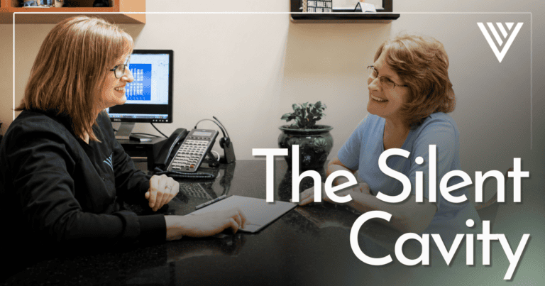 Doctor and patient smiling having a conversation